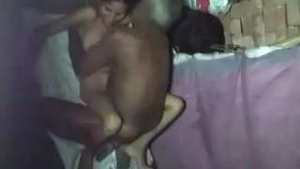 Elderly village man engages in sexual activity with a young woman while another man films their encounter