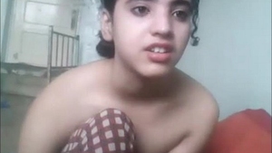 Innocent Desi teen with brown hair and big boobs