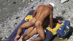 Peeking at naked babes on the beach
