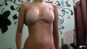 A stunning girl undressing for a man