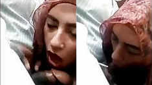 Arab woman in hijab performs oral sex in a vehicle