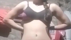 Young woman indulges in self-pleasure with her hands