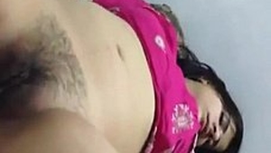 Cute Desi girl's leg opens to reveal her hairy pussy while sleeping