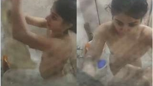 Cute girl films herself taking a bath on camera