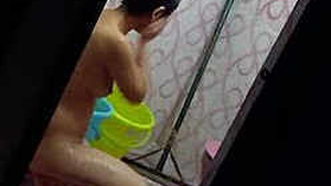 Hidden camera captures Indian babe washing her undies in the shower