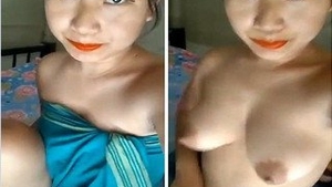 Watch a gorgeous girl strip down and reveal her breasts and pussy in this exclusive video