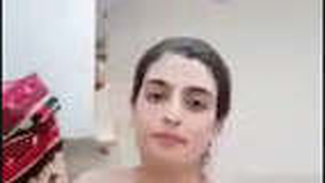 Indian wife showcases her large breasts and indulges in self-pleasure