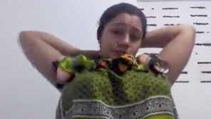Busty aunt teases with her big breasts in online video