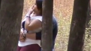 Audacious college sweetheart performs a risky oral sex act in an outdoor public space