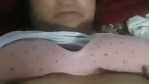 Gorgeous and aroused non-professional woman pleasuring herself with her hand