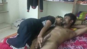 Indian wife gives handjob to her husband before sex