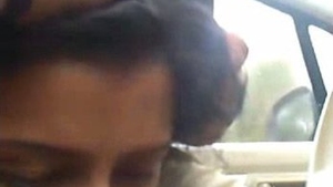 Young couple in car indulges in steamy action
