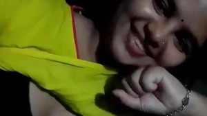 An enticing Indian beauty reveals her breasts and moist pussy while pleasuring herself