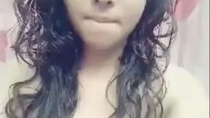 A young African American woman misbehaves in front of the camera