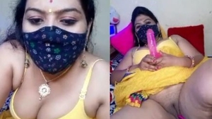 Geeta, the seductive aunt, moistly stimulates her intimate area with her fingers