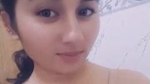 A cute Japanese girl takes a bath in the bathroom