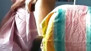 Naked husband and dressing wife