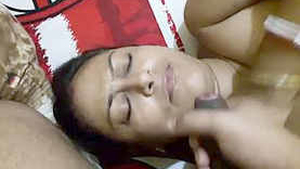 A mature Indian milf gives oral pleasure to a well-endowed partner and receives semen as a reward.