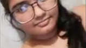 Indian girl with large breasts displays in office