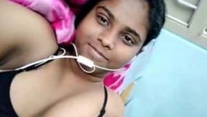 A seductive Indian beauty engages in a video chat