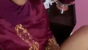 Aroused woman employs a sex toy for self-pleasure