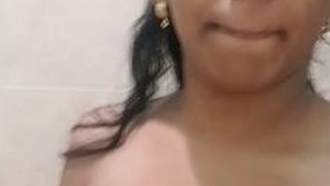 Attractive Indian girl flaunts her breasts and vagina