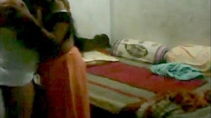 Traditional Indian couple engages in intimate bedroom activities