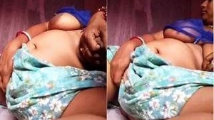 Busty Desi Budi Squeezes and Shakes Her Tits in a Sexy Dance