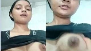 A cute webcam girl flaunts her breasts for the camera