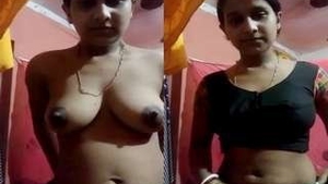 Desi boudi reveals her big boobs and pussy in a seductive striptease