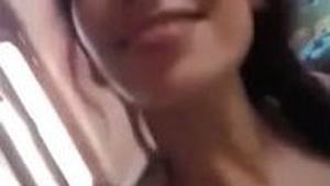 Young woman enjoys ride while chatting with friends who are filming