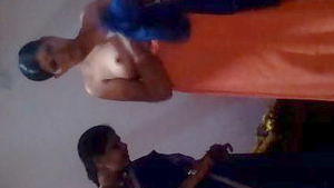 Indian aunt's wardrobe change caught on camera with focus on her breasts