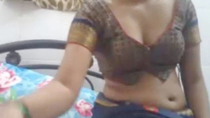Indian beauty in saree performs on webcam