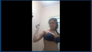 A girl with large breasts in a restroom
