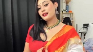 Anna's cute smile and sexy body in an orange sari
