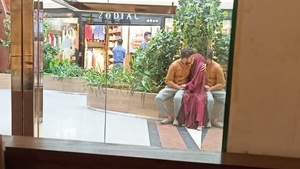 Passionate smooching in a daring public setting