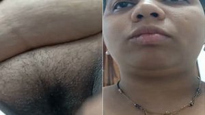 Boobs and pussy of a horny Indian bhabhi on display in amateur video