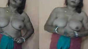 After sex Indian woman with big XXX tits and her lover put on clothes