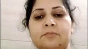 Indian bhabhi pleasures herself with her fingers in a seductive manner